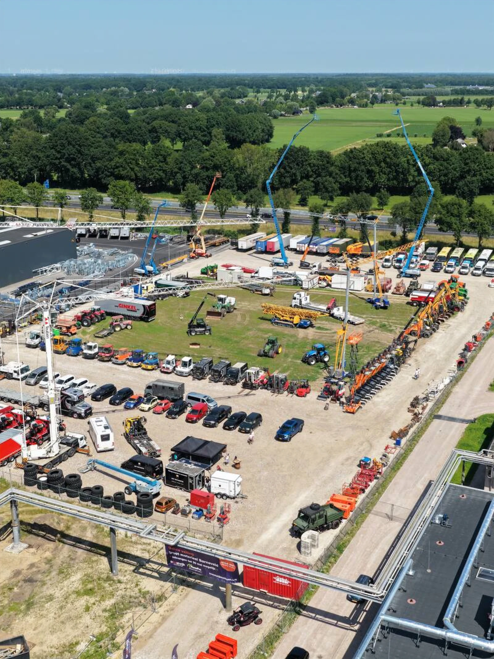 Aerial view of a TBAuctions yard with machinery and vehicles ready for auction